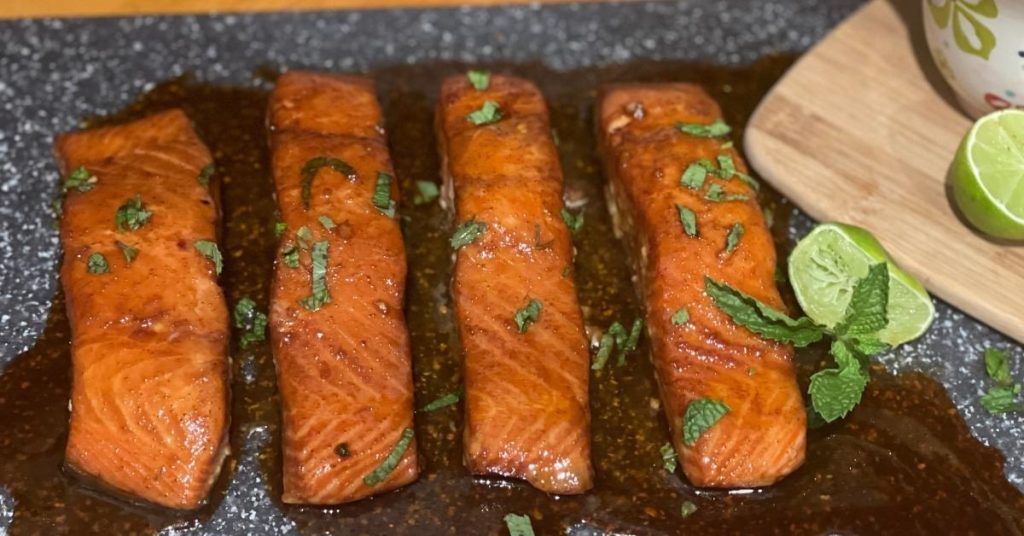 Drizzle the dressing over the salad and top with salmon