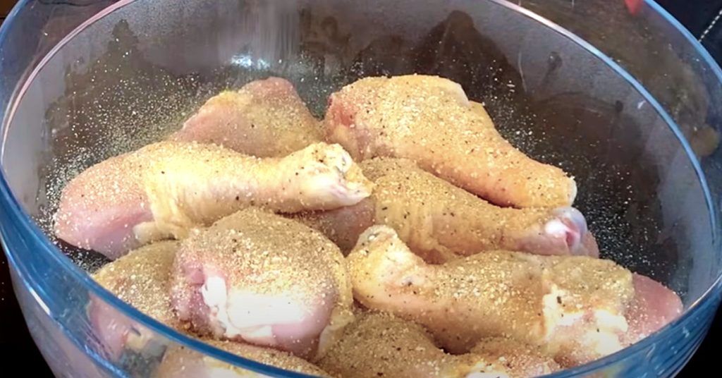 seasoning the chicken drumsticks