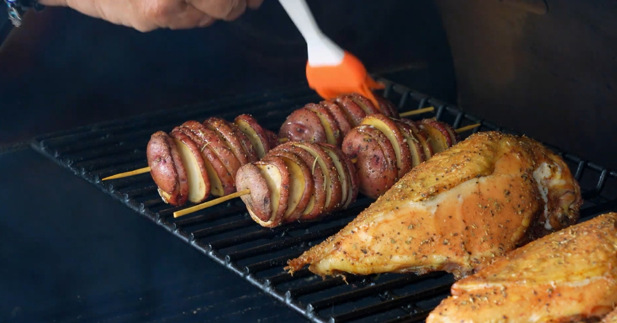 Brush the potatoes and chicken breasts